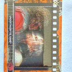 TOPPS 2021 WWE UNDERTAKER VS KANE ORANGE 32/50 COMMERATIVE MATCHSTRIP RELIC CARD