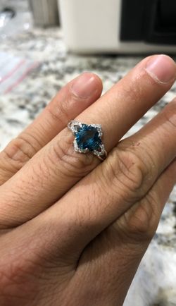 14kt White gold blue/white diamond and light blue topaz ring