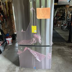 New 24.7 Cu Ft GE refrigerator