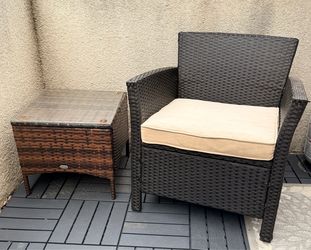 Wicker patio chair and glass top side table