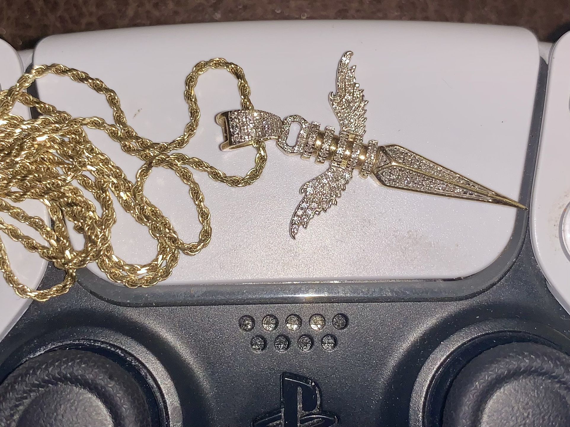 10 karat solid gold dagger cross pendant with wings real diamonds and 10 karat gold rope chain 100% real willing to meet anywhere to verify 600  cash