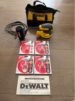 DeWalt orbital sander with assorted sanding discs