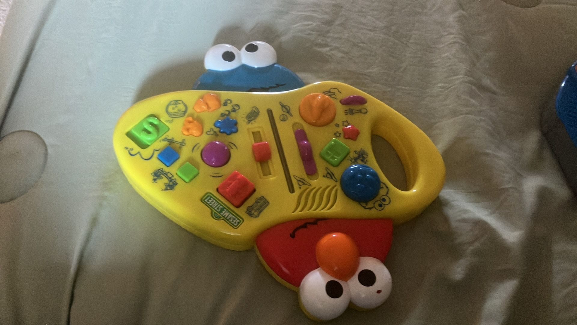 Sesame Street Giggle Sound Station, a musical toy for toddlers.