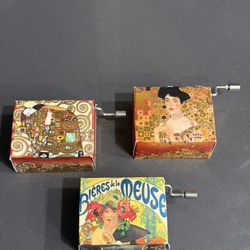 Mini German Hand-crank music boxes featuring classic art designs