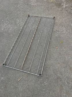 Rack - 2’ x 4’ Heavy Duty Metal Shelving in Fair Condition. Not Bent, Simply Outdoor Normal Use.