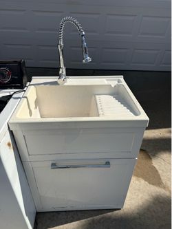 Utility sink hot and cold with sprayer