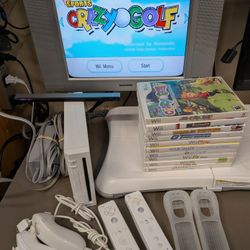 Nintendo Wii With 2 Remotes/Nunchucks, Balance Board And 10 Games