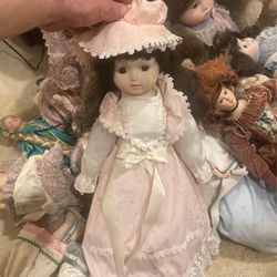 Heritage Porcelain Doll Brown Hair Pink Dress Musical Doll (stain on dress)