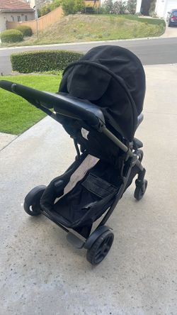 Graco stroller - used but good condition. Easy to maneuver. Large under carriage - black stroller