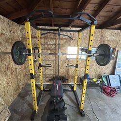 Workout cage with weights and bench