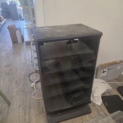 Black Door Glass Cabinet with wheels.