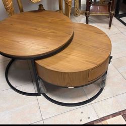 Nesting Coﬀee Tables LOOK UP Modern nesting coﬀee table set with wood-look finish and metal frame. TIME PERIOD Contemporary ORIGIN Unknown ESTIM
