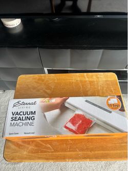 New Eternal Living Vacuum Sealing Machine  Description: This is a brand-new, space-saving kitchen vacuum sealer designed to prolong food freshness and