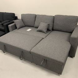 Brand New sectional sofa with chaise storage and pull out bed!