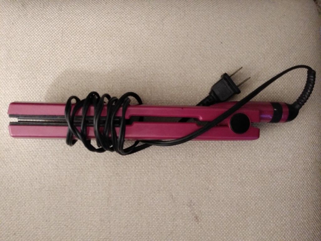 Pink Conair flat iron