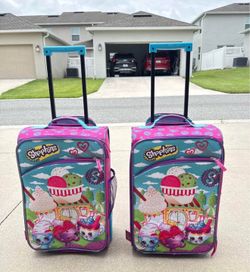Selling 2 Shopkins kids suitcases, $25 for both.