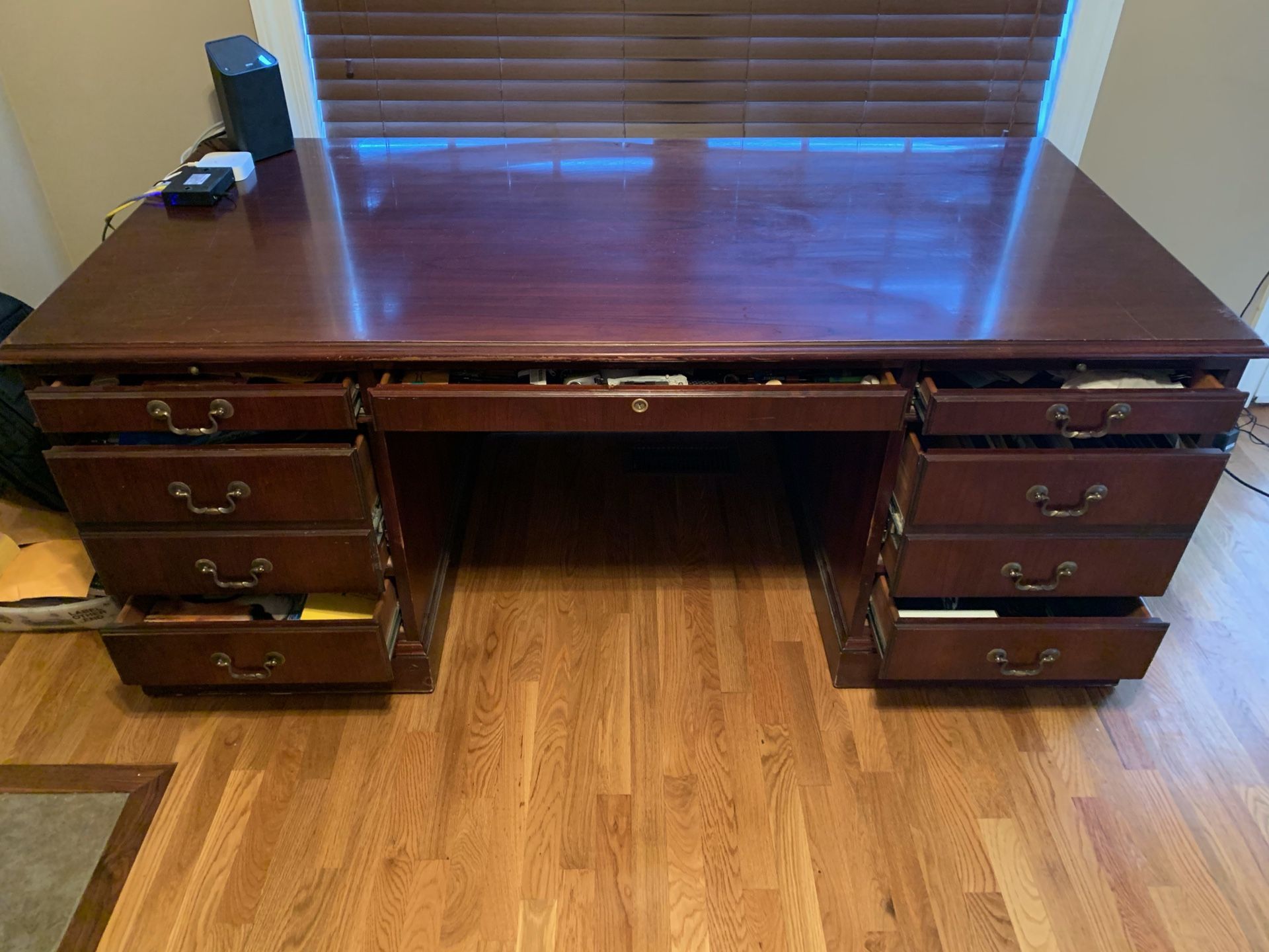 Large executive desk. Very solid construction with some wear on top but still a very nice desk. All drawers function properly.