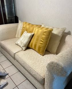 2 cream love seats with Pillows
