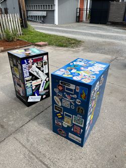Two steel filing cabinets covered with stickers