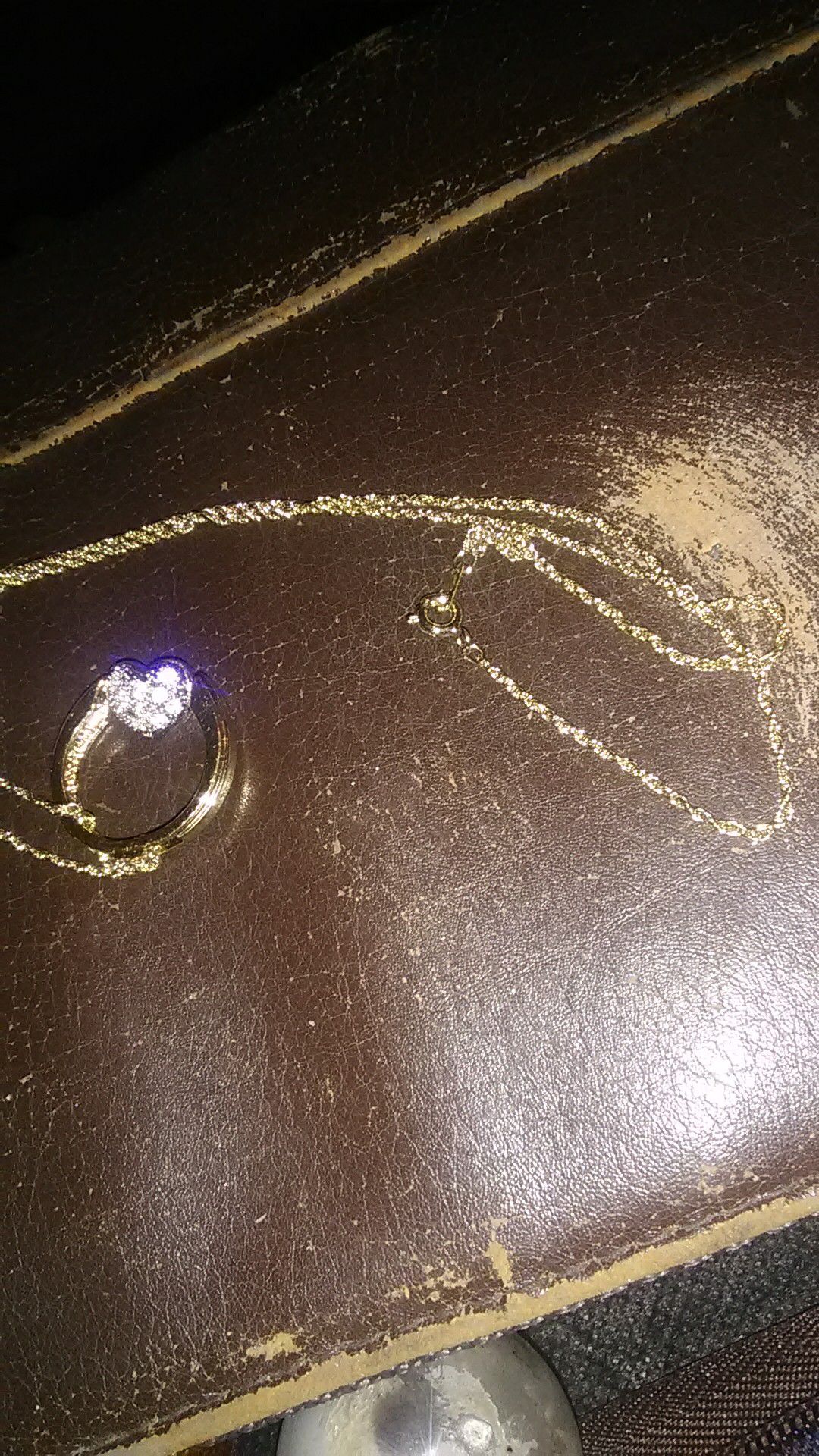 Gold chain with heart filled with diamonds