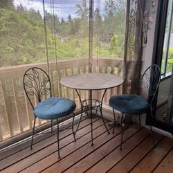 Table and Two Chairs With Cushions 