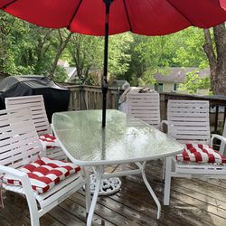 Large glass patio glass top Table, New umbrella top, Umbrella base And Red/white Cushions 