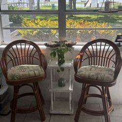 Rattan swivel arm chairs