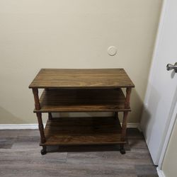 Wooden shelf with wheels, good condition