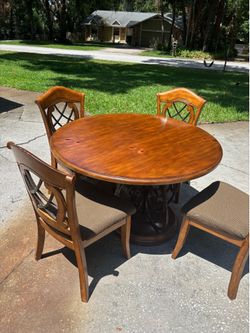 4' solid wood round dining table with four chairs