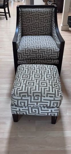 wood-framed upholstered armchair
