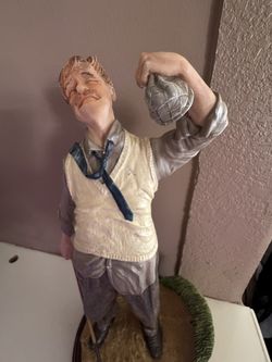 Antique golfer statue
