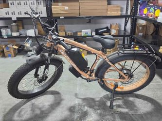 Baolujie 26-inch fat tire electric mountain bike in an orange-khaki finish