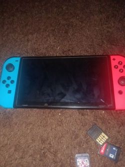 Nintendo Switch with Neon Joy-Cons and Games