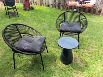 Two patio chairs with cushions and one small table black