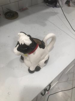 Moo cow milk pourer used to make a sound