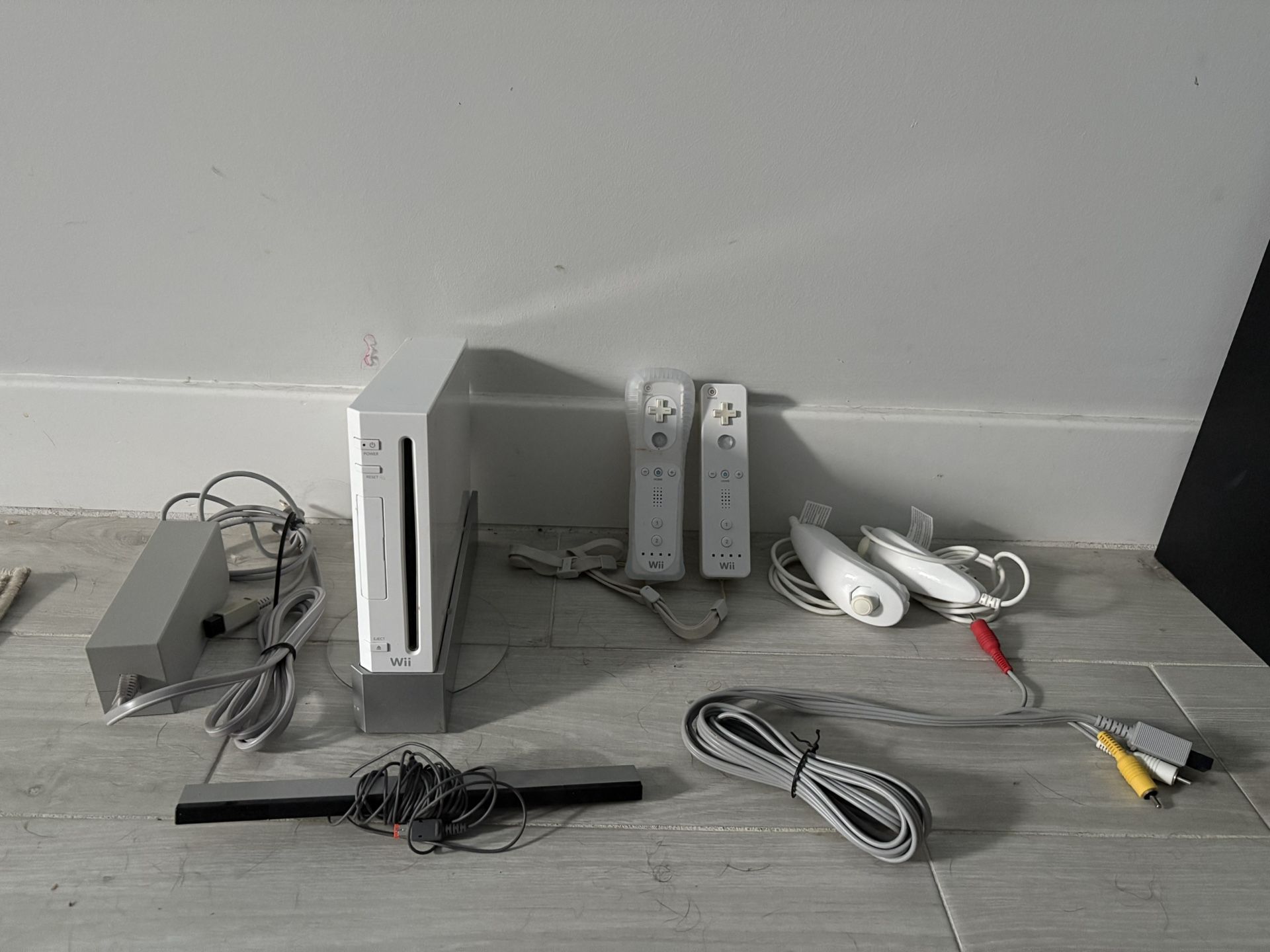 Nintendo Wii Console Bundle – 2 Remotes, 2 Nunchucks, Wii Fit, & Classic NES Games