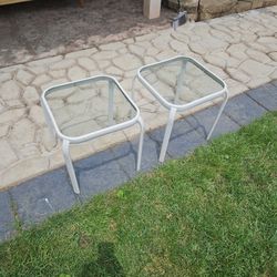 Two small glass top patio tables