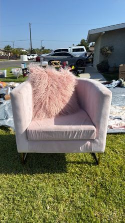 Pink chair with fluffy pink pillow