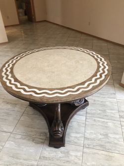 42” Round ornate wood table with cool base