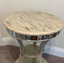 Table with mirror accents