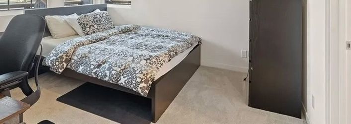 IKEA black bedframe, dressers and side tables