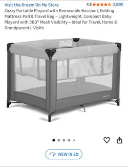 Portable play yard bassinet