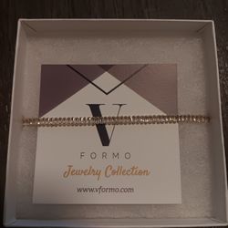 The jewelry piece in the image is a bracelet from the VFormo Jewelry Collection