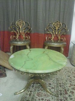 Antique marble table and bras golden chairs and base of table