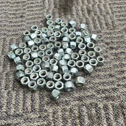 Zinc plated 3/8 16 nylon lock nuts with light rust