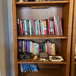 Two wood bookshelves with backlighting