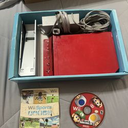 Red Nintendo Wii With Super Mario Bros And Wii Sports 