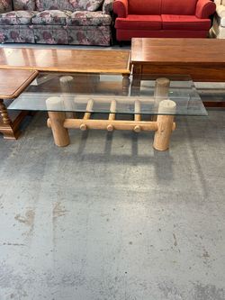 Log cabin style glass top coffee table (in store)
