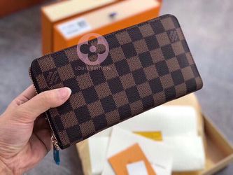 Leather wallet Louis Vuitton Brown in Leather - 32481273