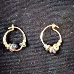14kt Gold Newborn Pierce Earrings Adorned With Gems.